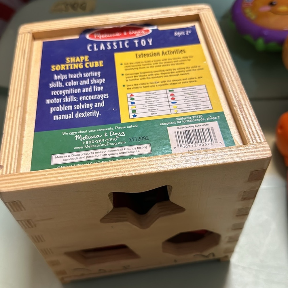 Wooden shape sorter - has some marker decorations from my toddler ☺️